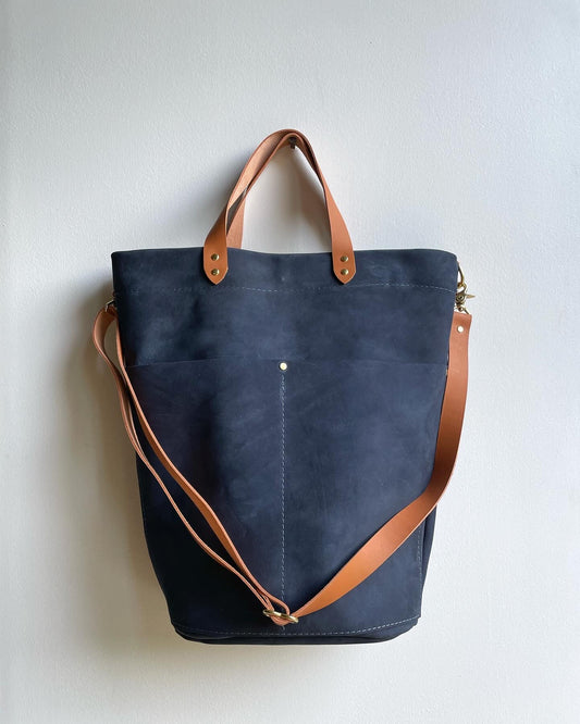 Midnight blue nubuck bucket bag with Tan contrast straps and handles