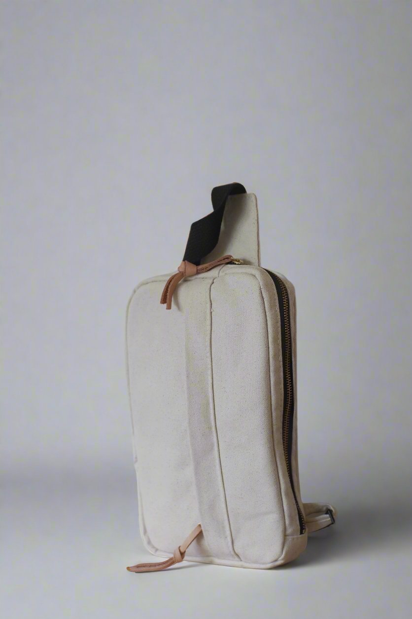 Canvas sling bag with adjustable strap