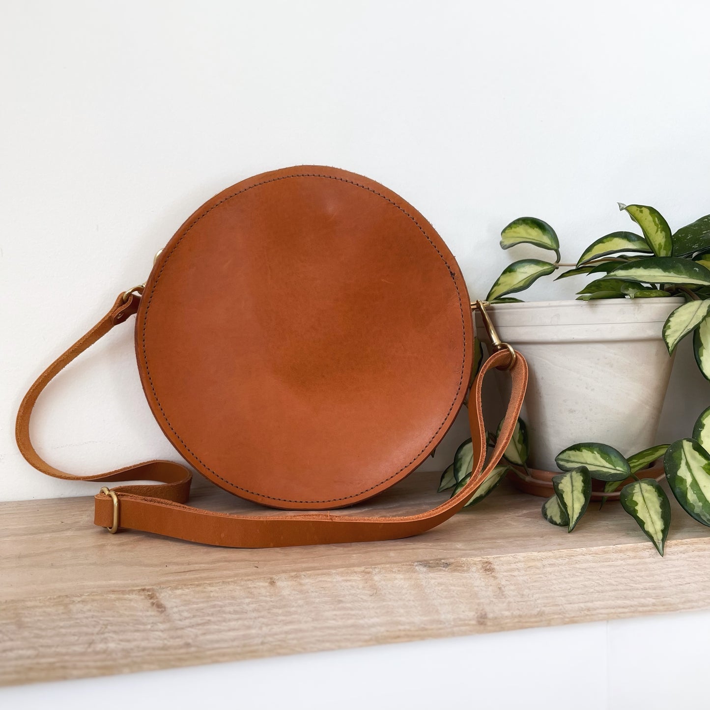 Tan leather mini circle crossbody